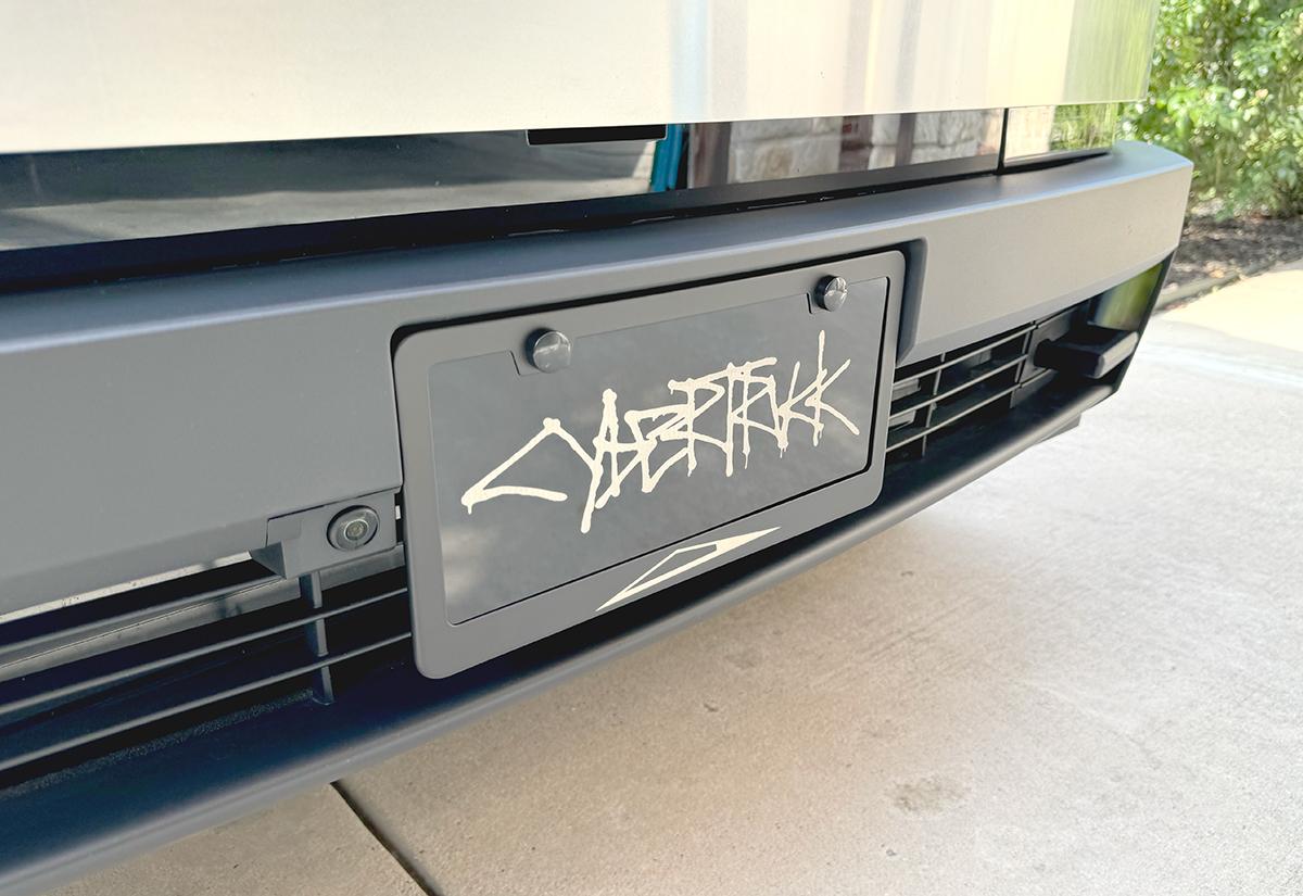 Tesla Model 2 ? [Giveaway] Custom License Plate Frame Raffle (with Your Text) + Discount Code club-vanity-cybertruck-graffiti-frame-left